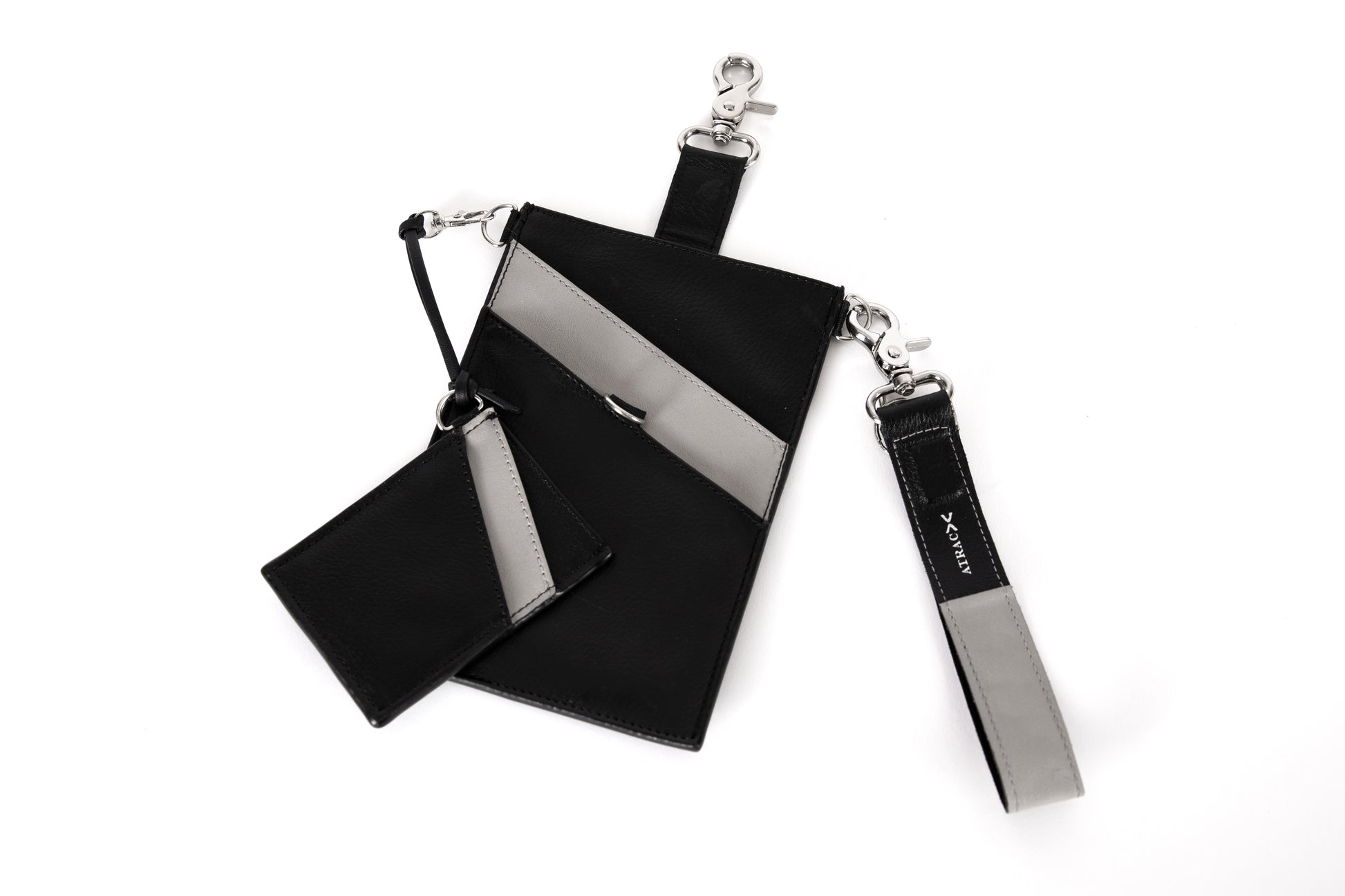 Black and gray, vegan leather phone pouch with a black and gray, vegan leather magnetic wristlet key chain  and a black and gray removable three pocket wallet