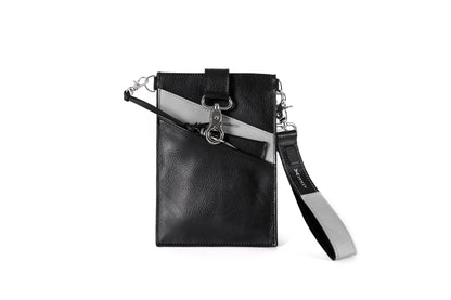 Black and gray, vegan leather phone pouch with a black and gray, vegan leather magnetic wristlet keychain and a black and gray removable three pocket wallet